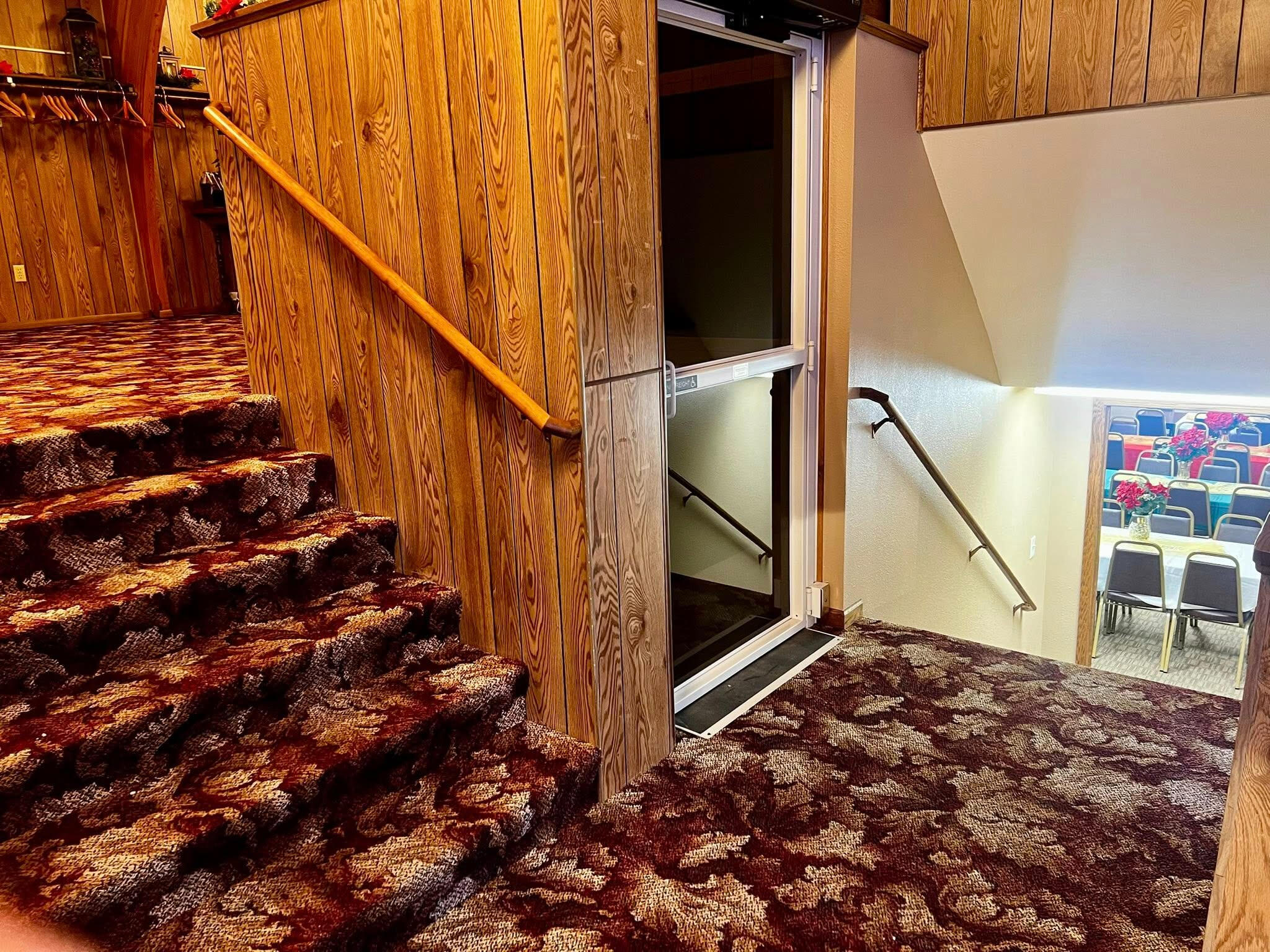 Stairs to go up to the sanctuary or down to the fellowship hall. Elevator available