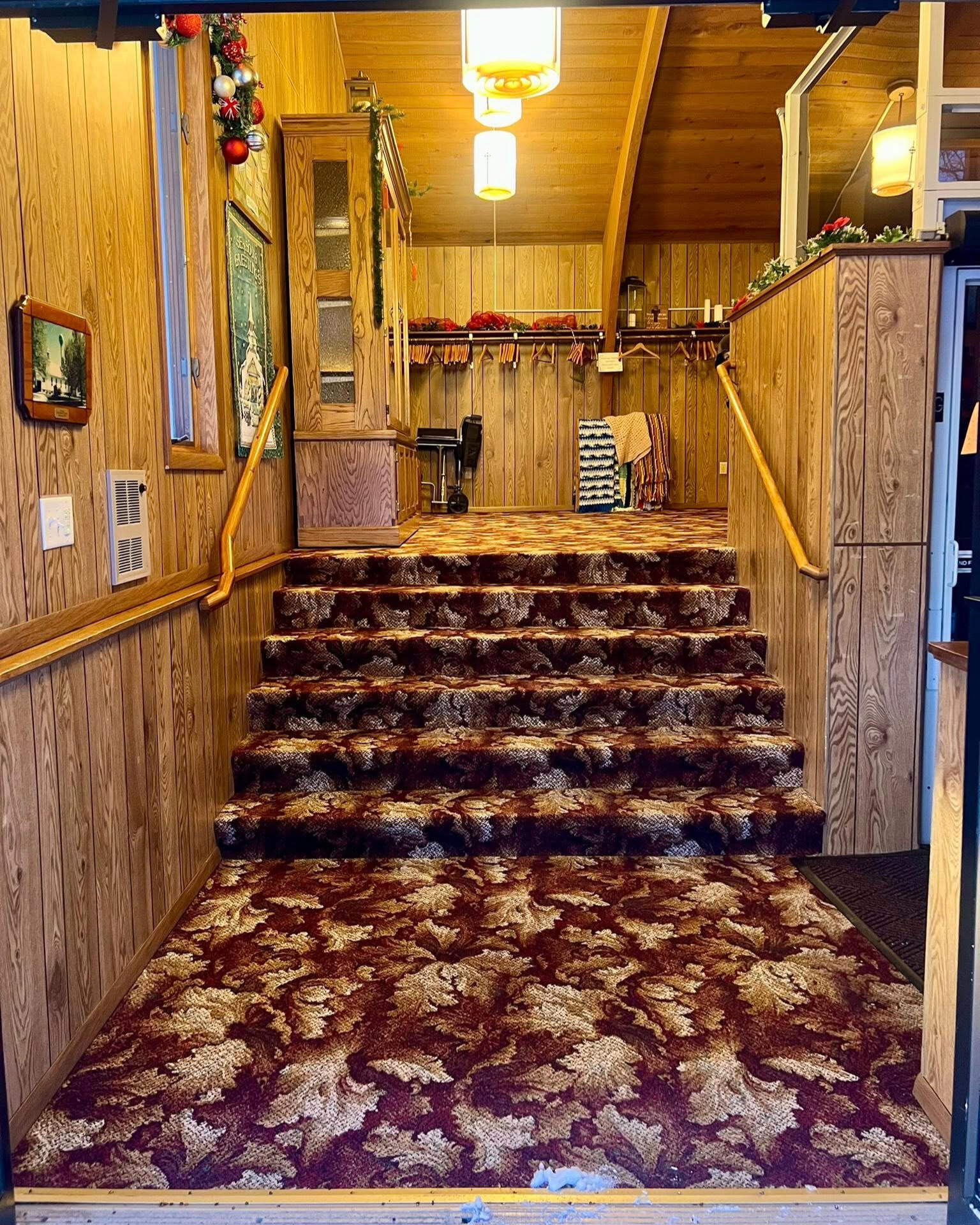 Stairs leading from front door up to vestibule and sanctuary